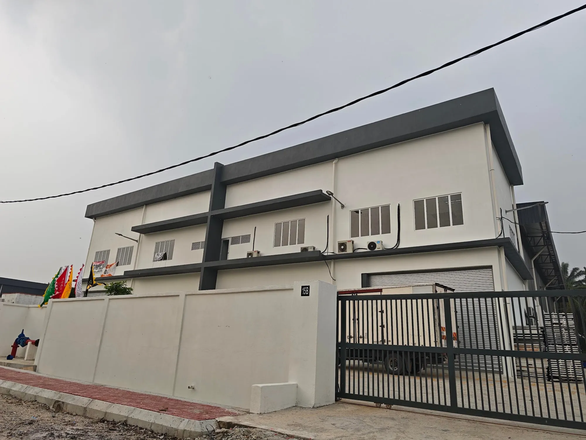 Completed two-storey factory with a gated compound, built by DCG Holdings